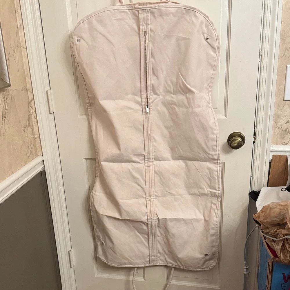 New McQueen Cream Garment Bag with hanger